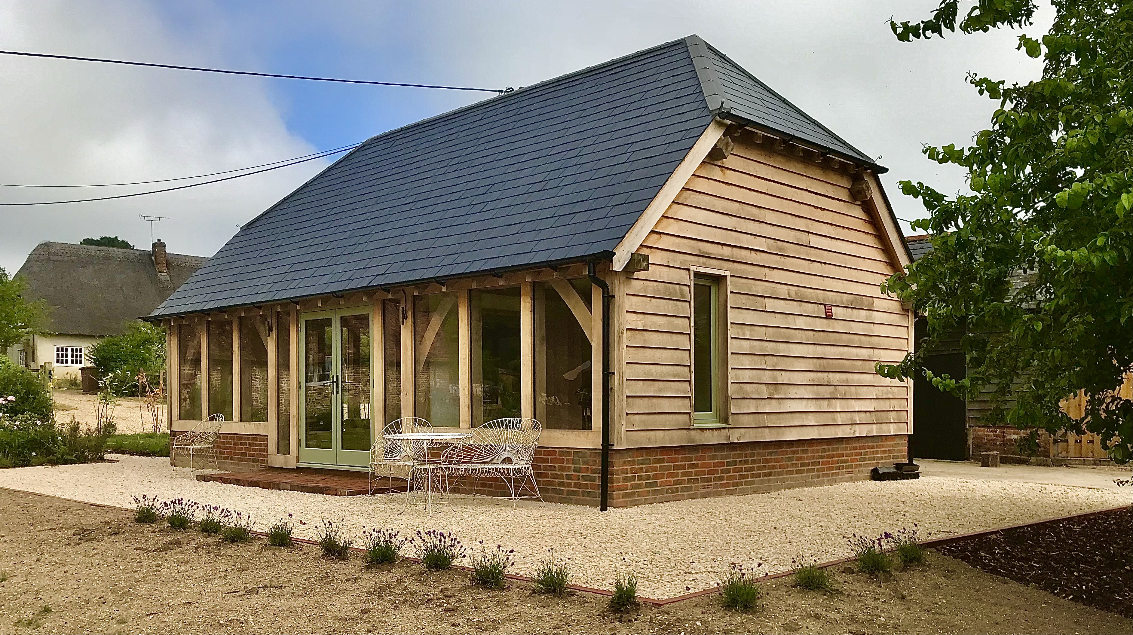 Oak frame barn exterior with slate roof