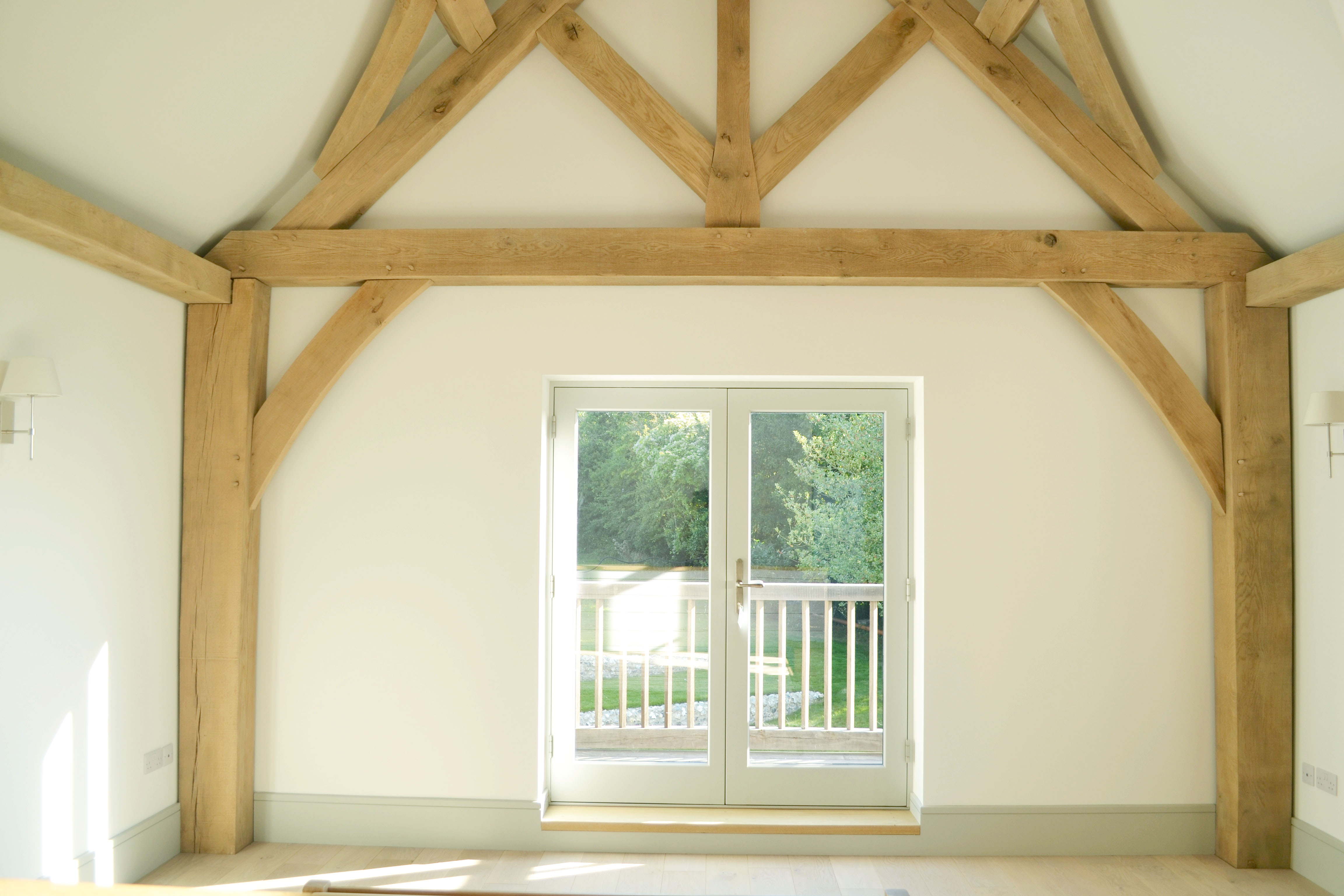 Oak frame vaulted living room with French doors